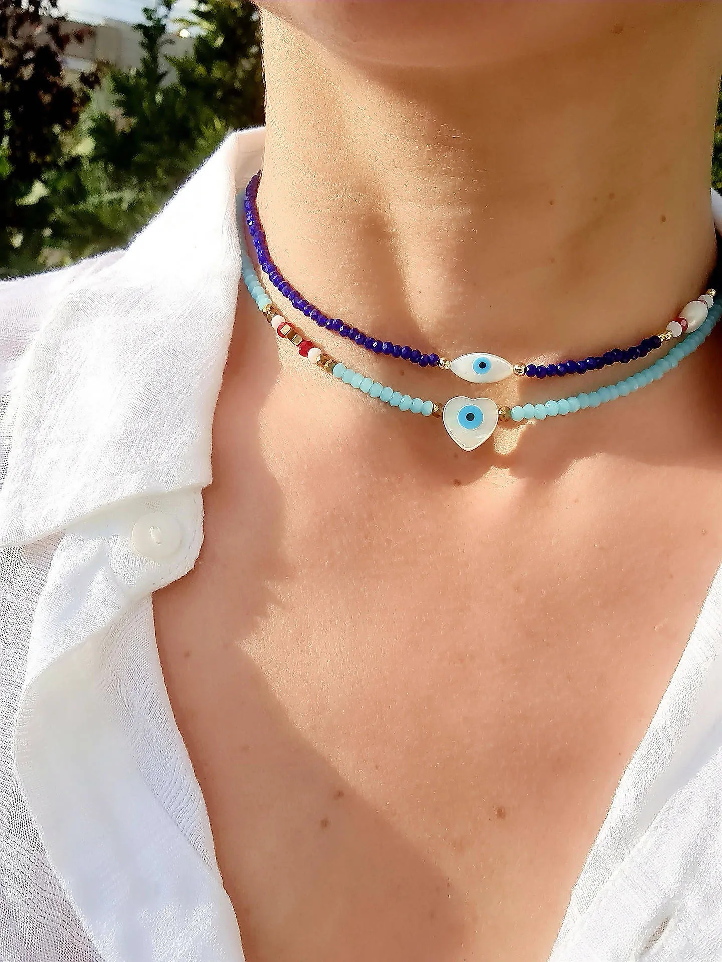 Crystal light blue with mother of pearl heart evil eye