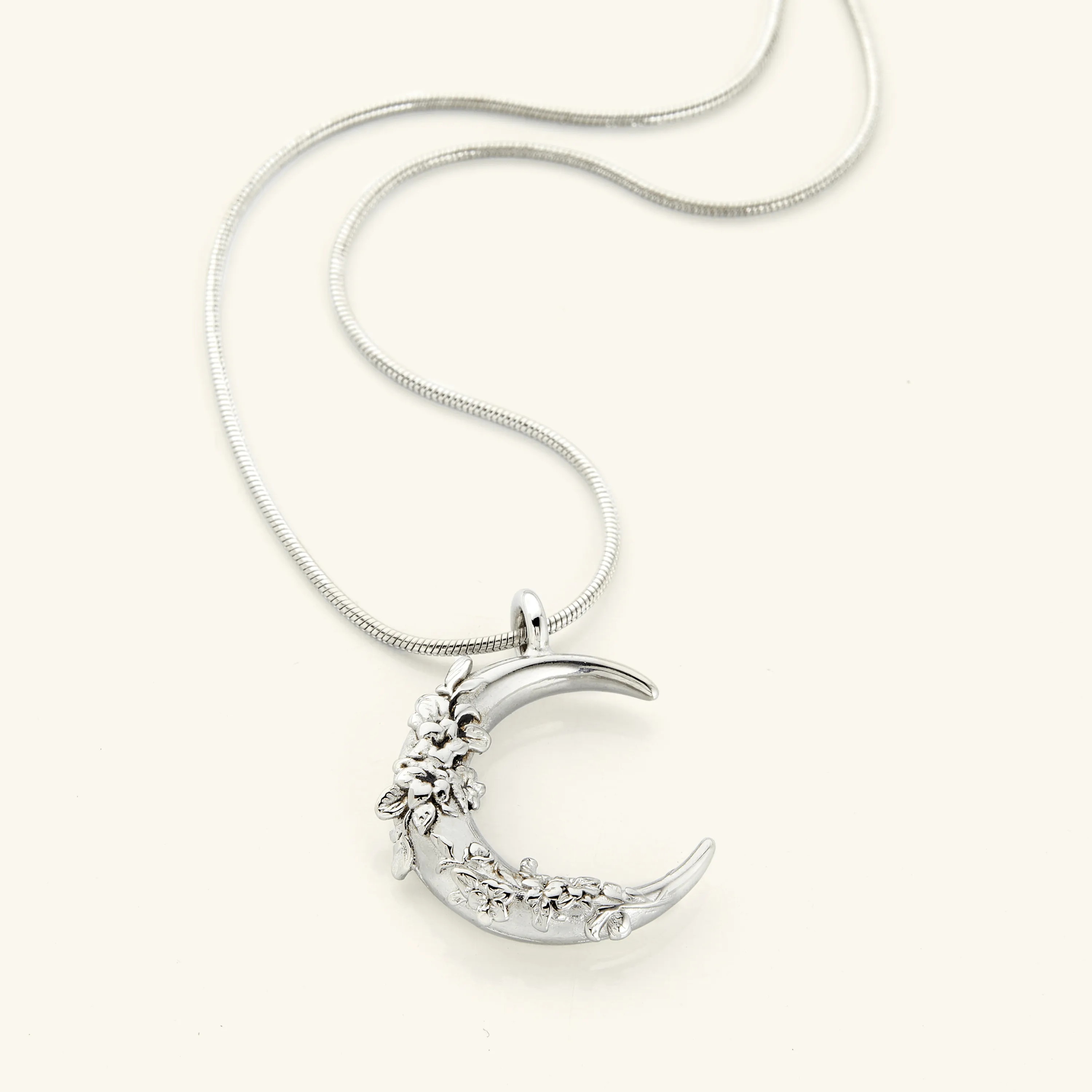 Crescent Shaped Jasmine Necklace by VELA and Nominal